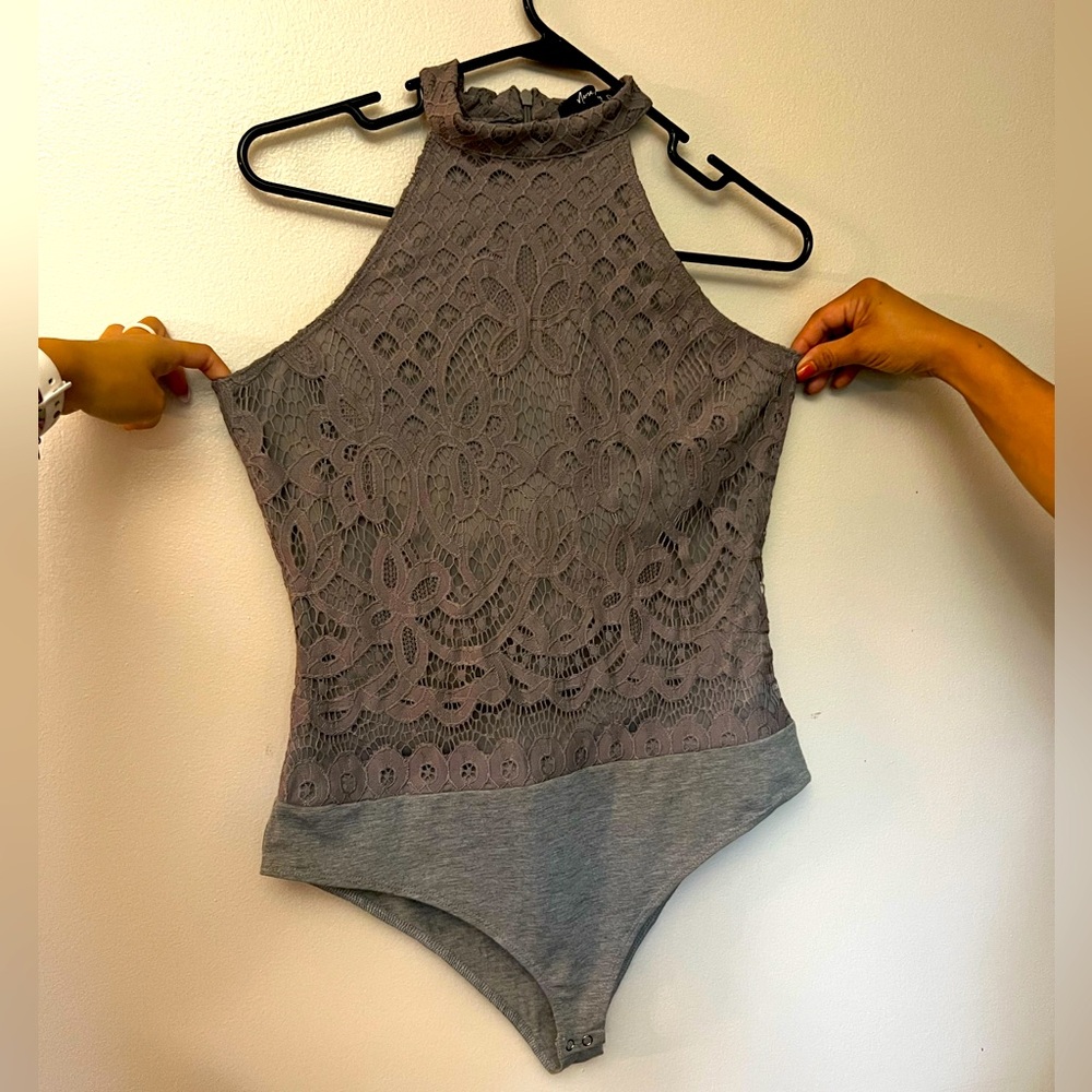 Grey, lace, high-neck leotard. Zipper back.